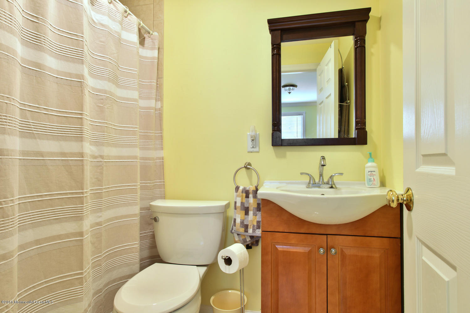 722 Drum Point Road Brick, NJ 08723 - Photo 16 of 28 a bathroom with a granite countertop toilet sink and mirror