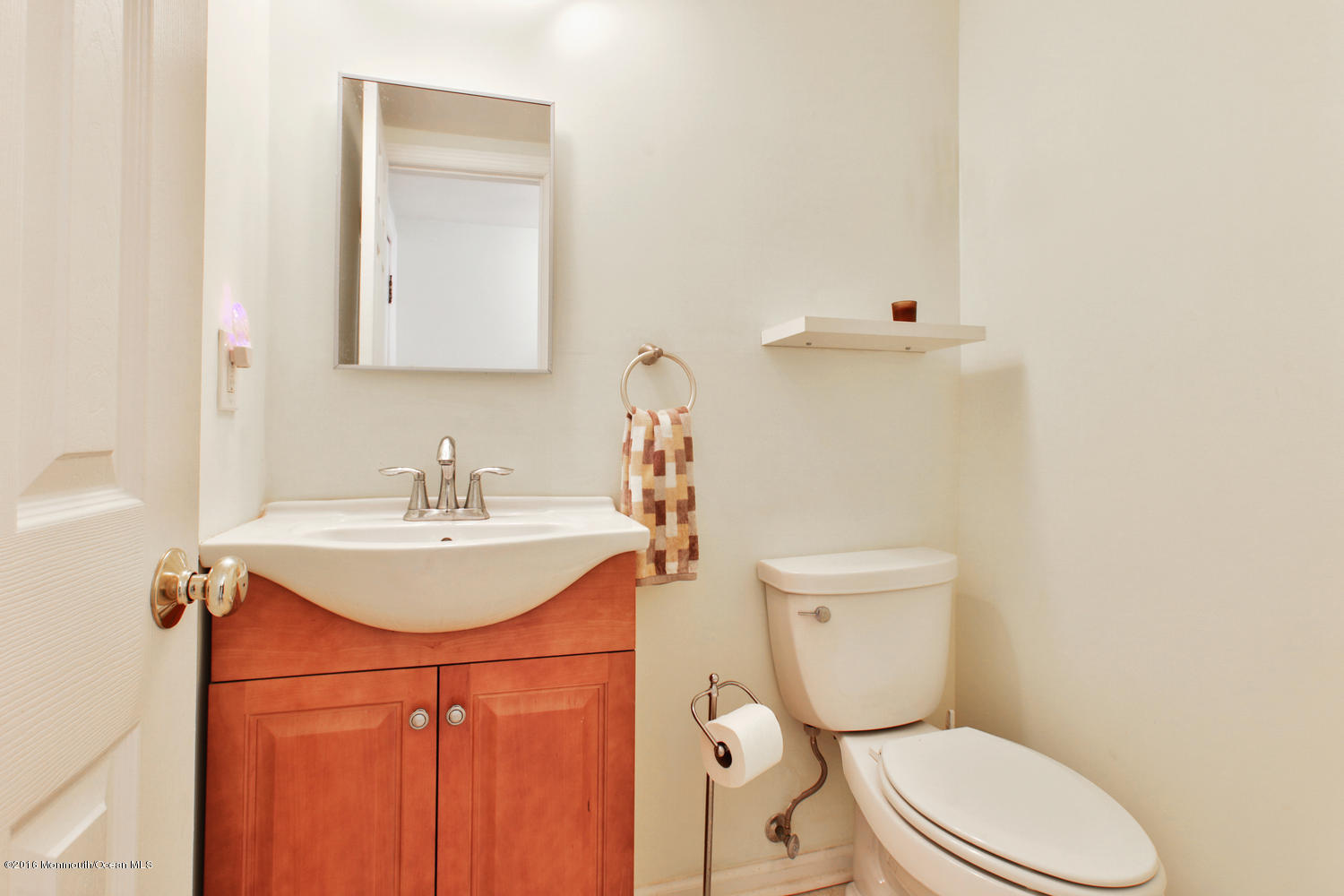 722 Drum Point Road Brick, NJ 08723 - Photo 18 of 28 a bathroom with a sink toilet and mirror
