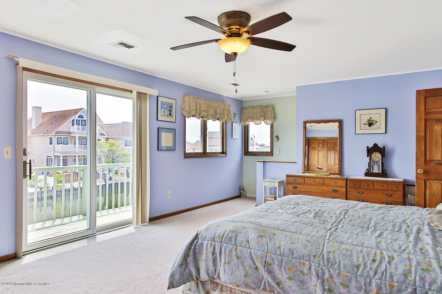 722 Drum Point Road Brick, NJ 08723 - Photo 19 of 28 a bedroom with a large bed and wooden floor