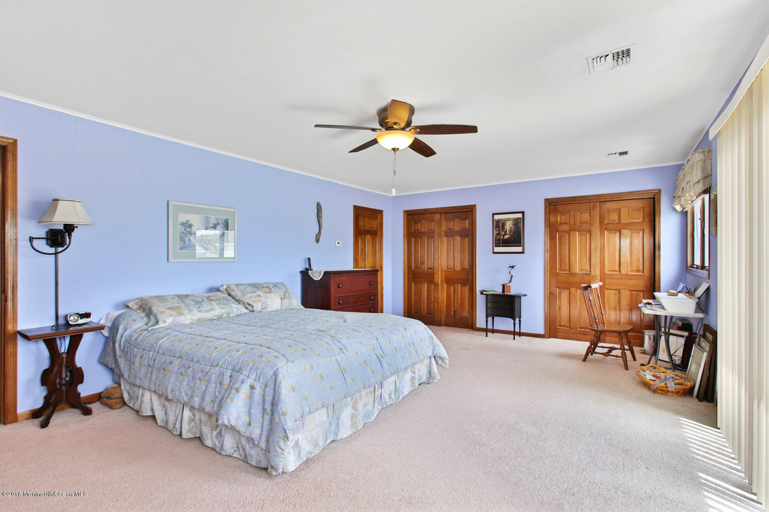 722 Drum Point Road Brick, NJ 08723 - Photo 20 of 28 a bedroom with a bed and a chandelier