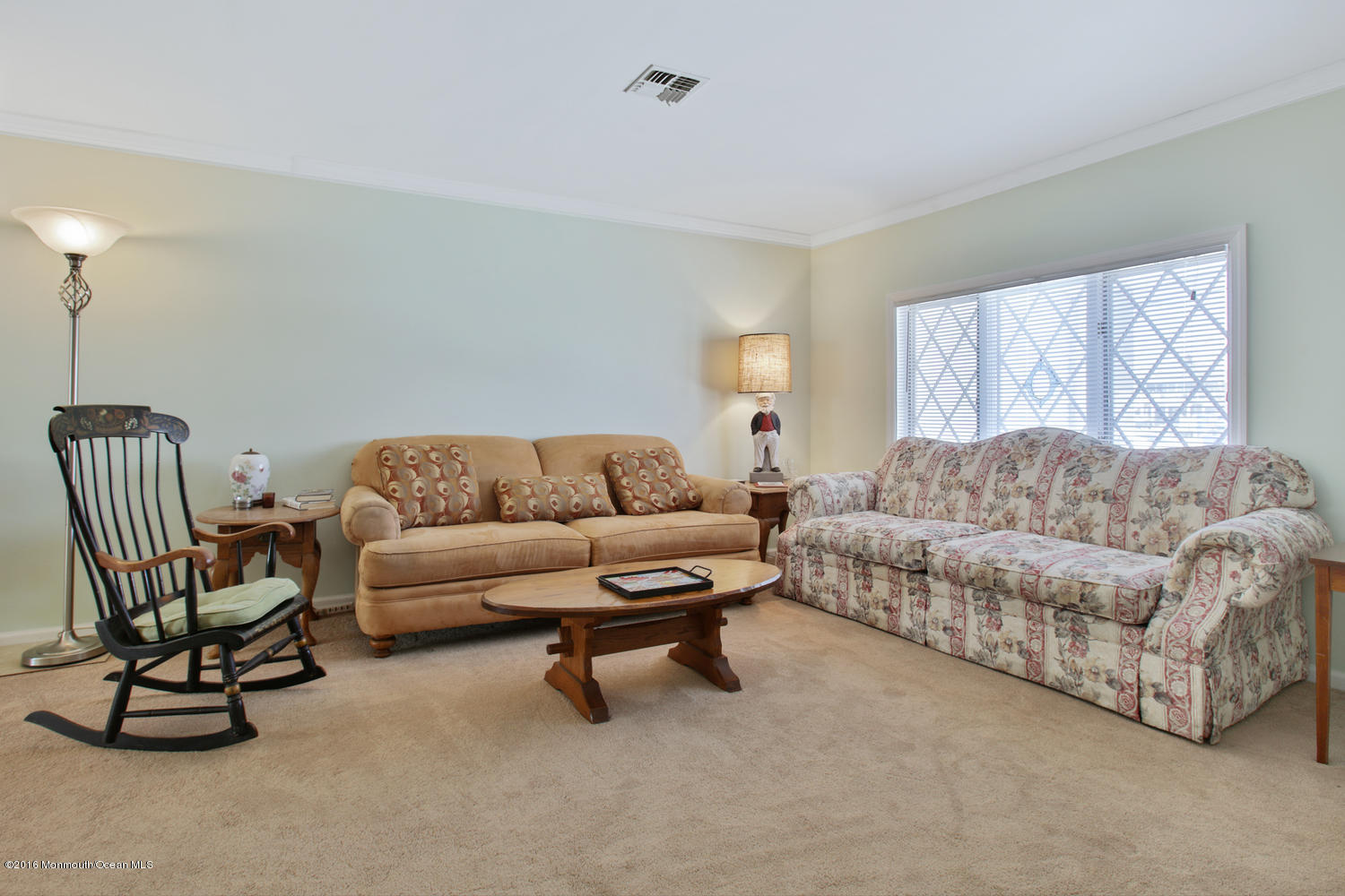 722 Drum Point Road Brick, NJ 08723 - Photo 25 of 28 a living room with a couch and a dresser next to a window