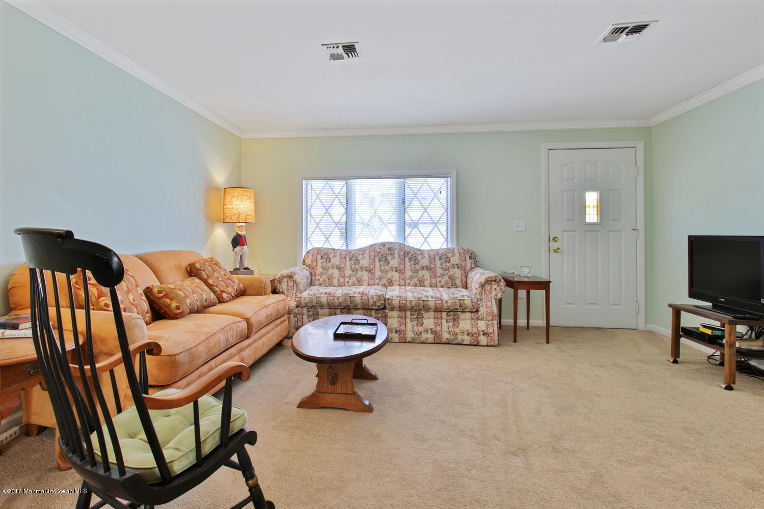 722 Drum Point Road Brick, NJ 08723 - Photo 28 of 28 a living room with furniture and a flat screen tv