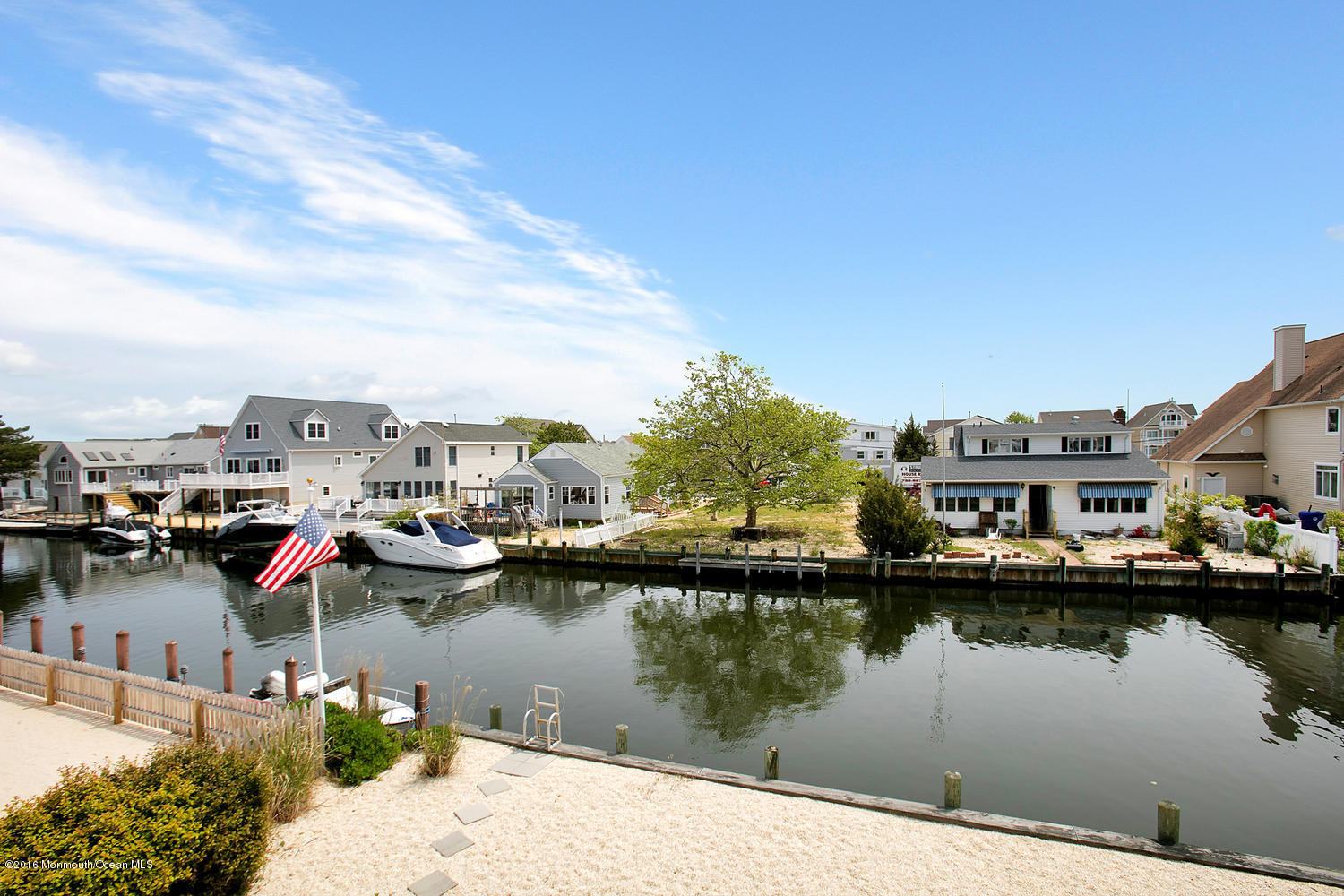 722 Drum Point Road Brick, NJ 08723 - Photo 3 of 28 a view of a lake with building