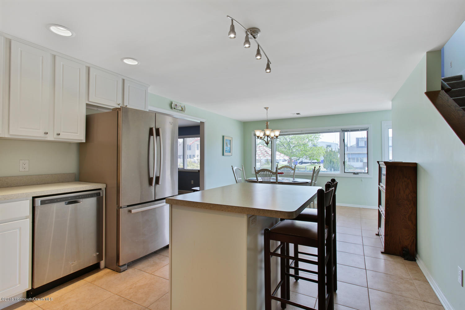722 Drum Point Road Brick, NJ 08723 - Photo 7 of 28 a kitchen with stainless steel appliances granite countertop a refrigerator a stove and a refrigerator with wooden floor