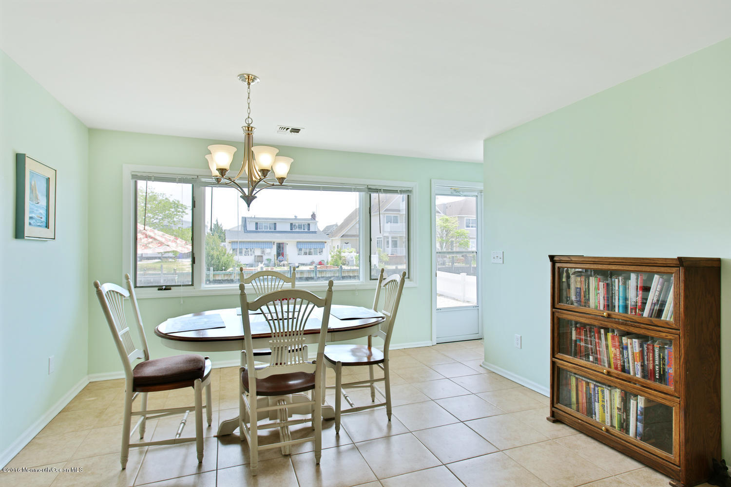 722 Drum Point Road Brick, NJ 08723 - Photo 9 of 28 a dining room with furniture a chandelier and wooden floor