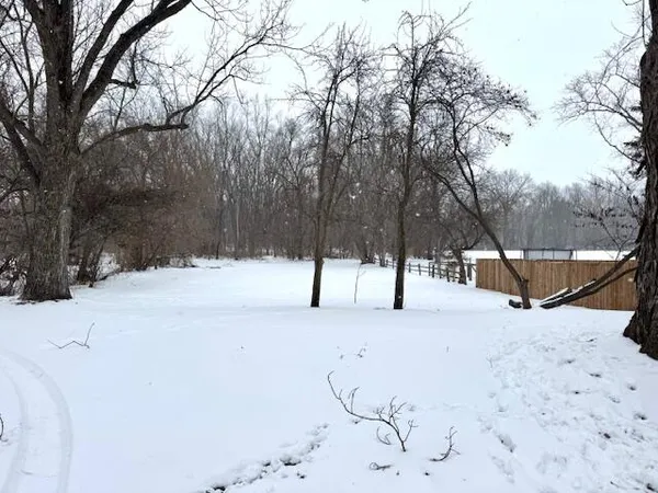 a view of snow on the road