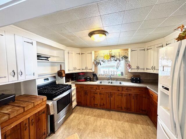 551 East Mound Street Knox, IN 46534 - Photo 4 of 23 a kitchen with stainless steel appliances a sink cabinets and wooden floor
