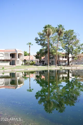 a view of a swimming pool with a lake view