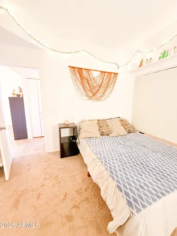 a view of living room with furniture and flat screen tv