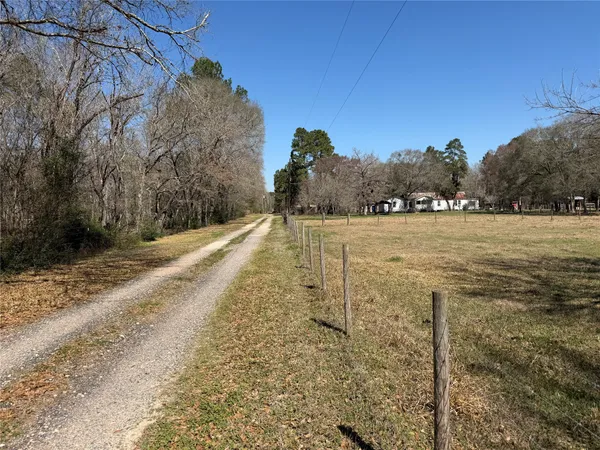 a view of a yard with an ocean view