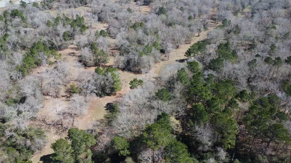 an aerial view of house with yard