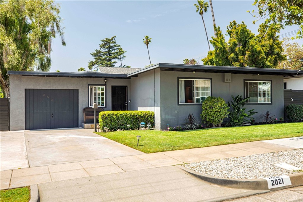 2021 Forest Avenue Pasadena, CA 91103 - Photo 1 of 18 a front view of a house with a yard and garage