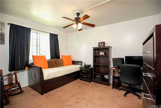 a workspace with a couch and a window