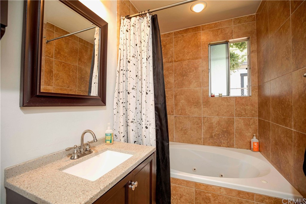 2021 Forest Avenue Pasadena, CA 91103 - Photo 13 of 18 a bathroom with a sink and a bathtub