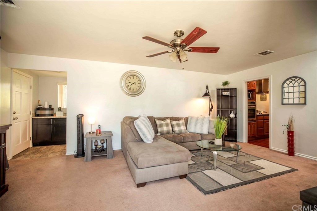 2021 Forest Avenue Pasadena, CA 91103 - Photo 4 of 18 a living room with furniture and a clock