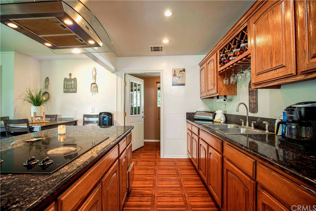 2021 Forest Avenue Pasadena, CA 91103 - Photo 6 of 18 a kitchen with stainless steel appliances granite countertop a sink and stove