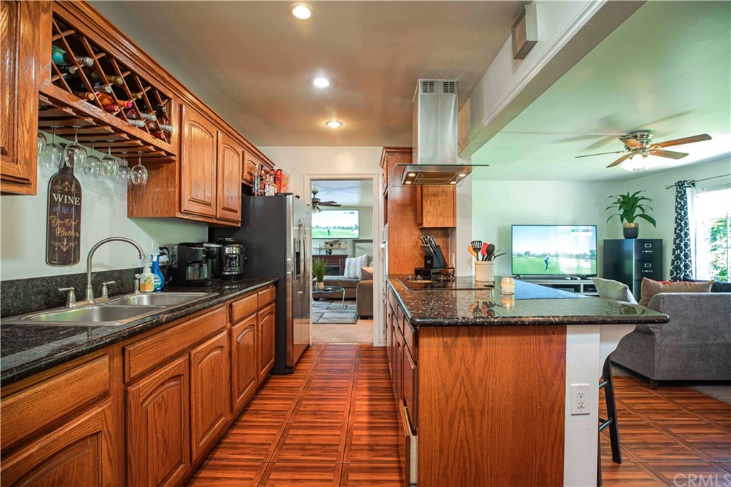 2021 Forest Avenue Pasadena, CA 91103 - Photo 7 of 18 a kitchen with stainless steel appliances granite countertop sink stove and cabinets