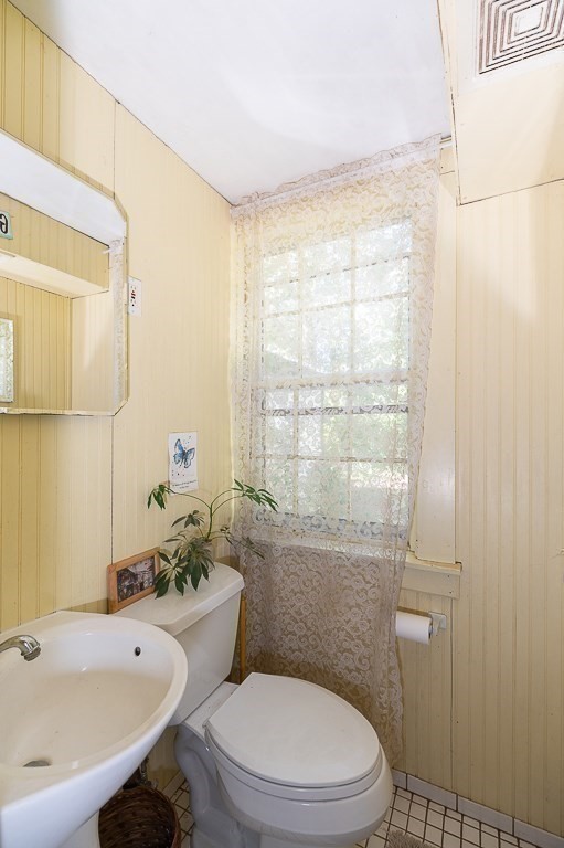 3 Ipswich Road Boxford, MA 01921 - Photo 14 of 37 a white toilet sitting next to a bath tub