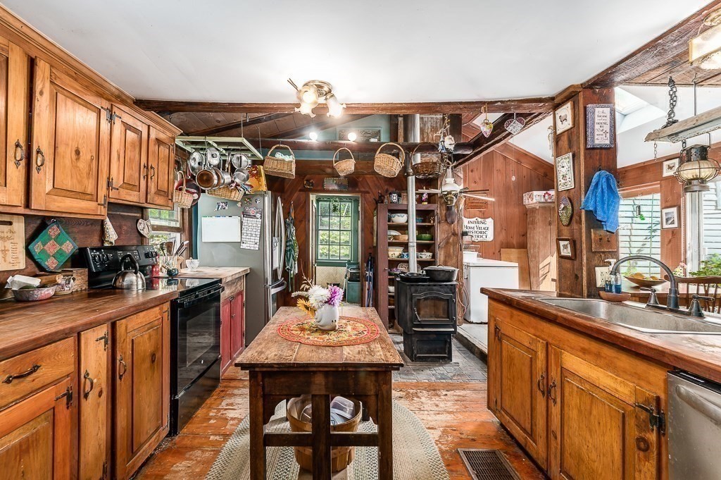 3 Ipswich Road Boxford, MA 01921 - Photo 16 of 37 a kitchen with stainless steel appliances granite countertop a sink stove and refrigerator