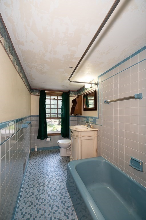 3 Ipswich Road Boxford, MA 01921 - Photo 25 of 37 a bathroom with a granite countertop sink a toilet and bathtub