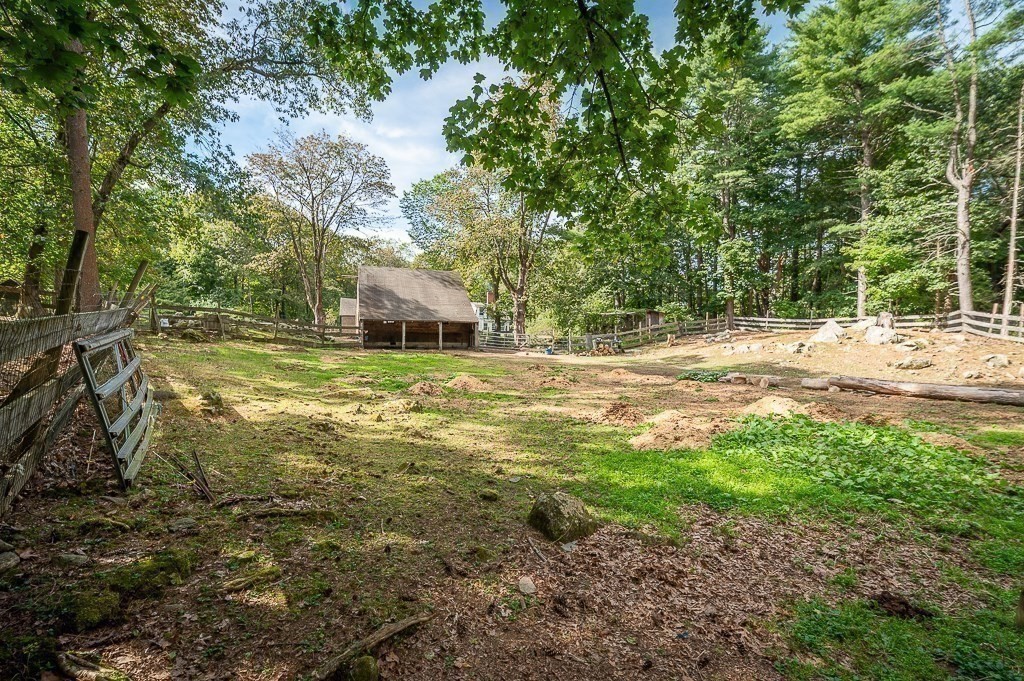 3 Ipswich Road Boxford, MA 01921 - Photo 32 of 37 a view of a yard with plants and large trees