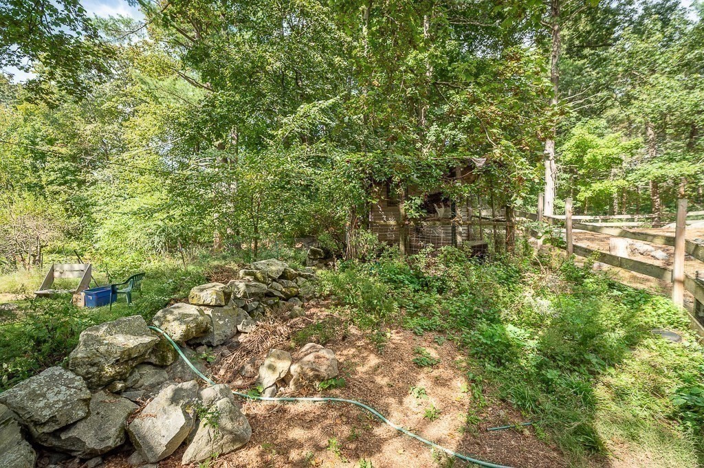 3 Ipswich Road Boxford, MA 01921 - Photo 33 of 37 a view of a garden with plants and large trees