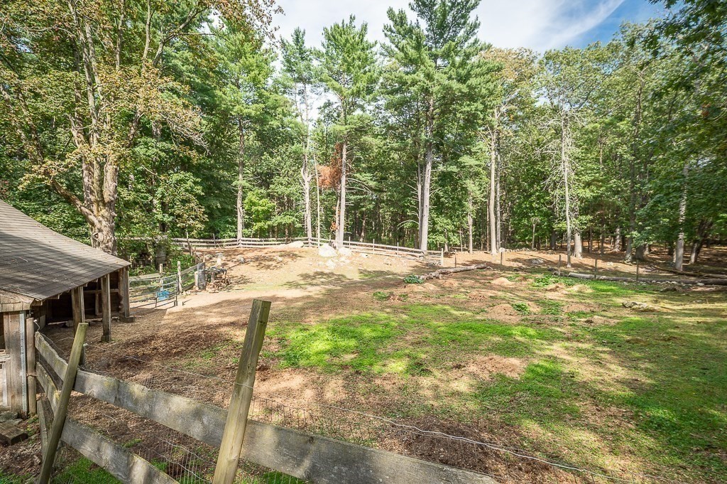3 Ipswich Road Boxford, MA 01921 - Photo 36 of 37 a backyard of a house with table and chairs