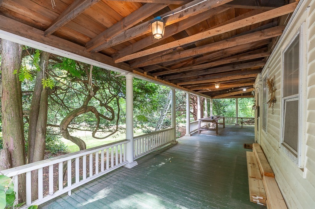3 Ipswich Road Boxford, MA 01921 - Photo 4 of 37 a view of a porch with wooden floor