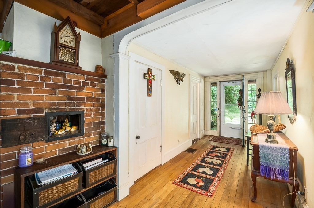 3 Ipswich Road Boxford, MA 01921 - Photo 10 of 37 a view of a livingroom with furniture and a fireplace