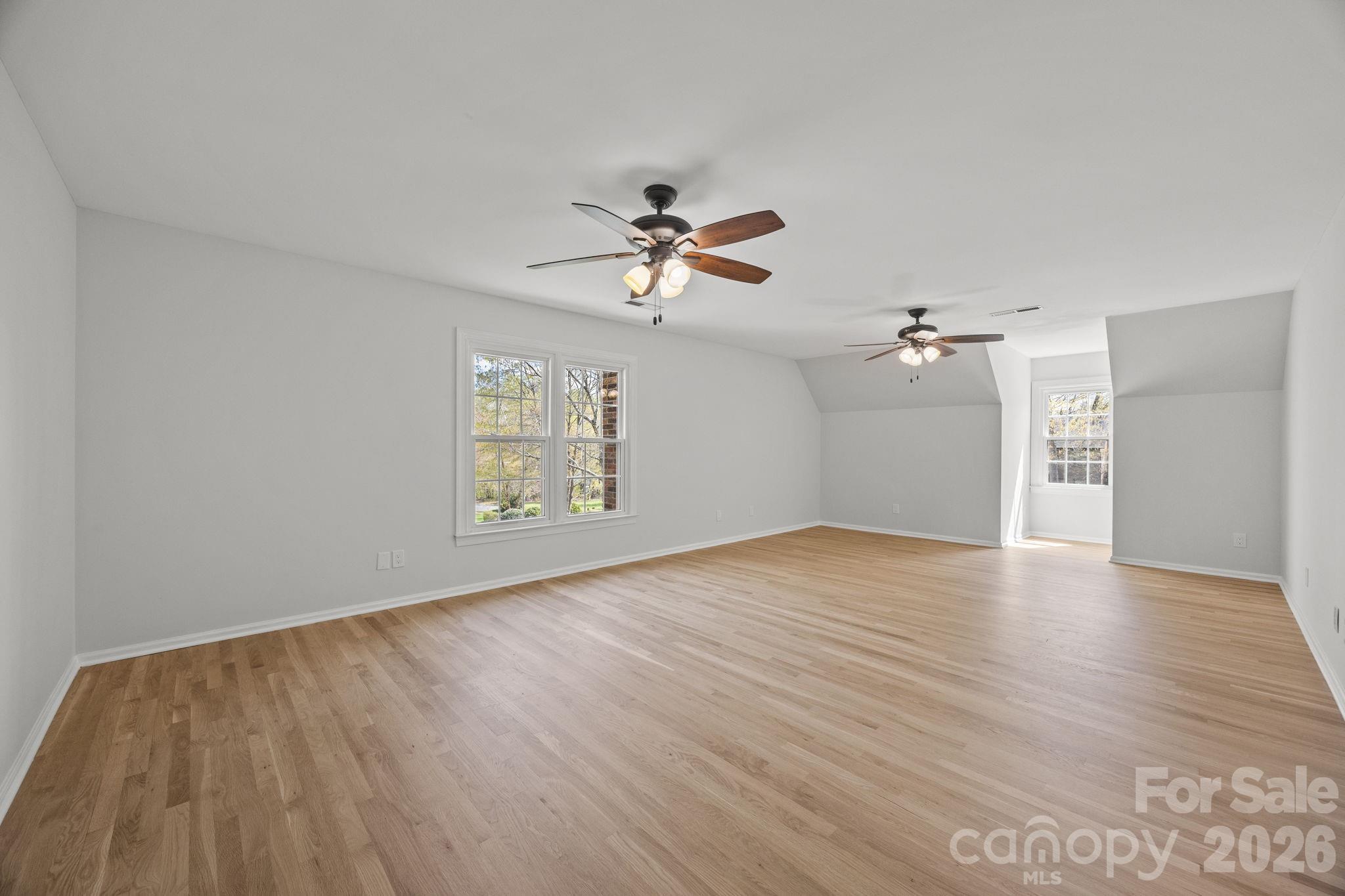 5243 Mintridge Road Mint Hill, NC 28227 - Photo 29 of 43 wooden floor in an empty room with a window