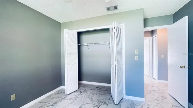a view of a hallway with closet area