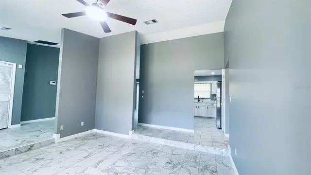 a view of a big room with wooden floor and cabinet