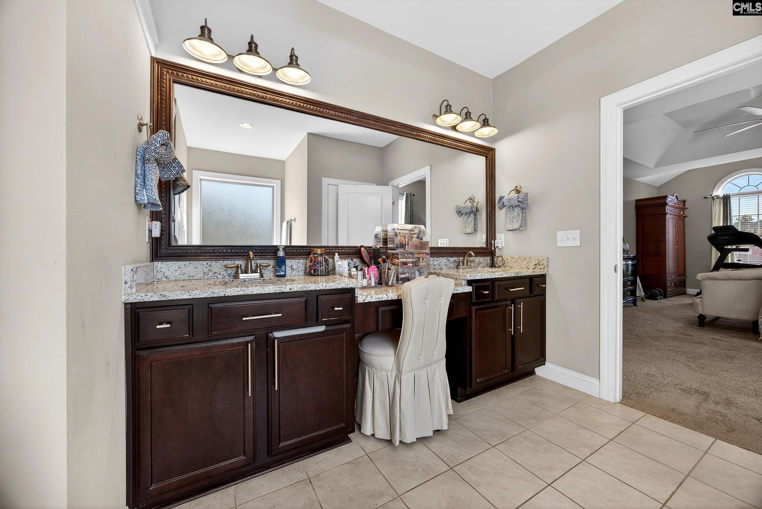 116 Renard Way Gilbert, SC 29054 - Photo 38 of 74 a kitchen with a sink and a stove top oven with wooden floor