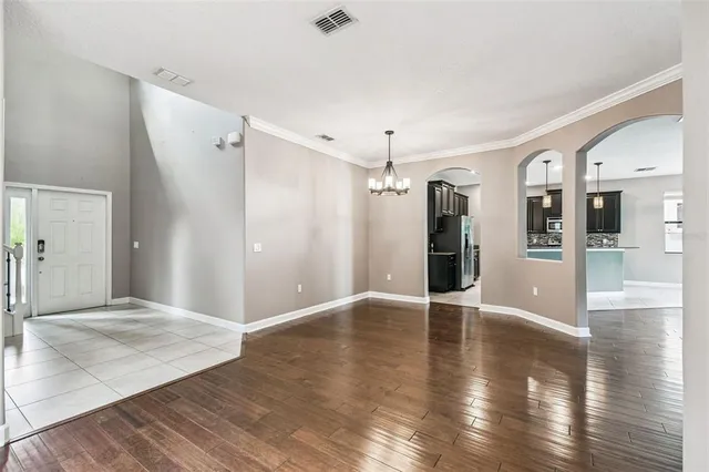 a kitchen with a sink and a large mirror