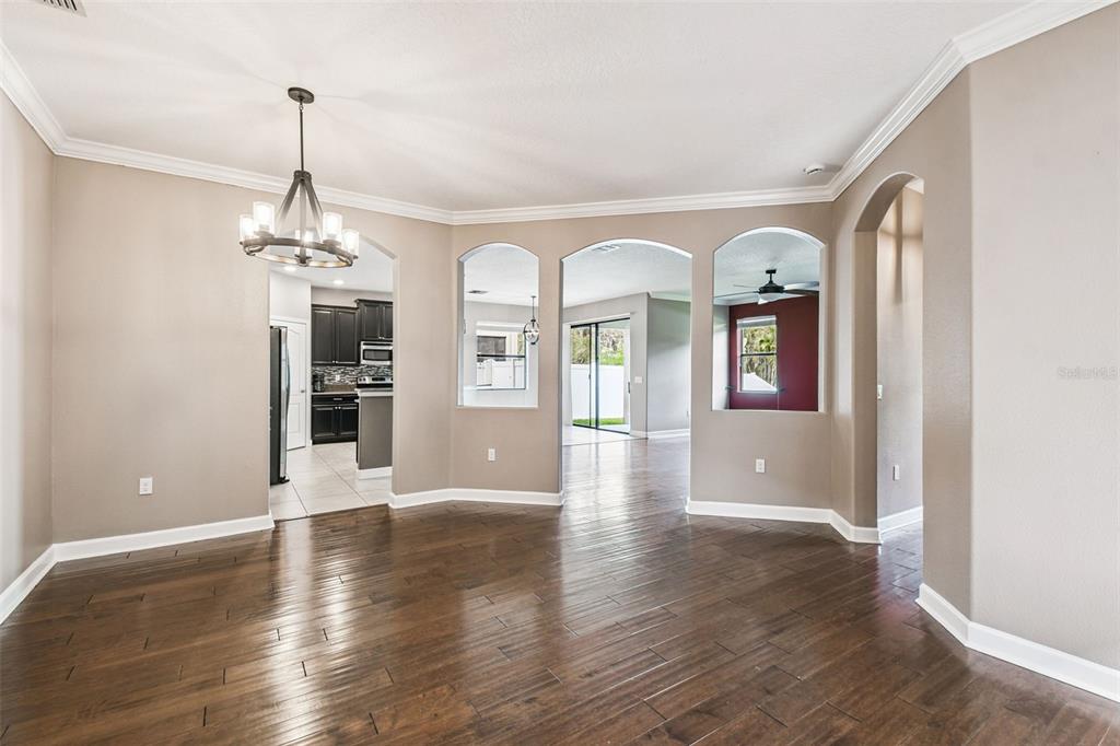 11737 Crestridge Loop New Port Richey, FL 34655 - Photo 18 of 100 a view interior of a house wooden floor and windows