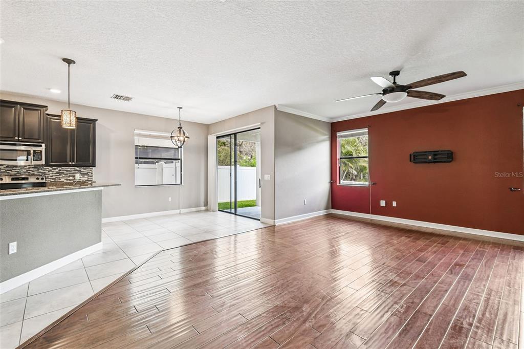 11737 Crestridge Loop New Port Richey, FL 34655 - Photo 22 of 100 a view of an empty room with kitchen and a window