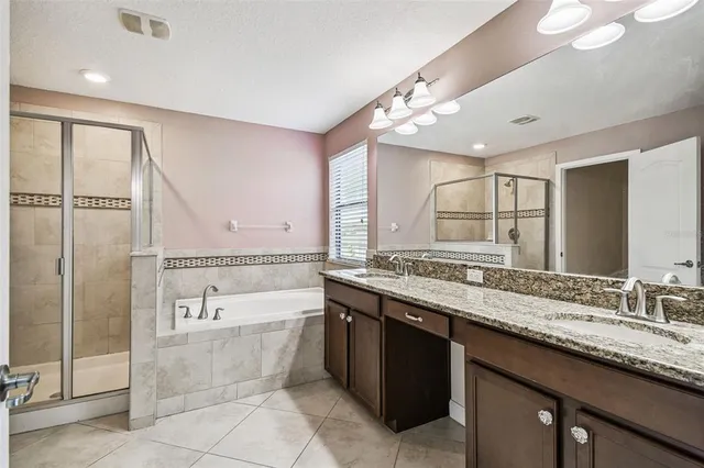 an aerial view of a house with a ocean view