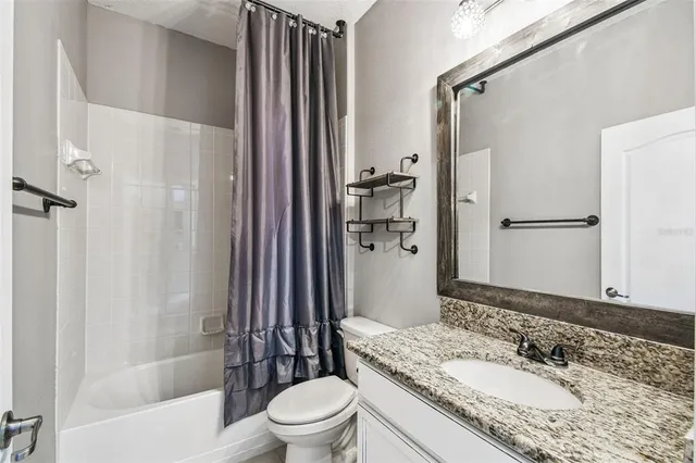 an aerial view of a house with swimming pool outdoor seating and yard