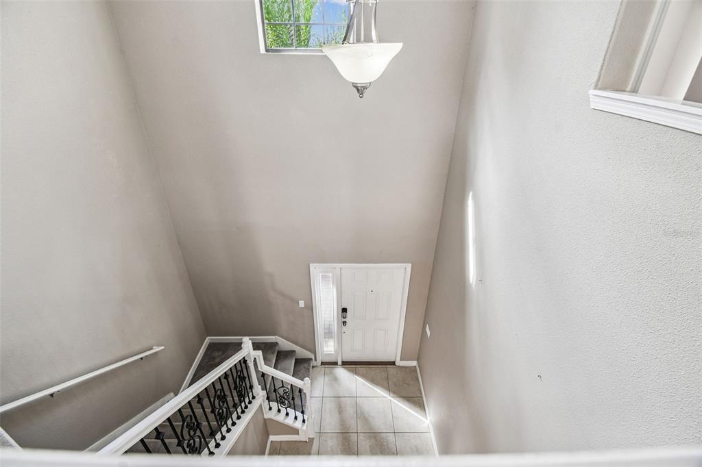 11737 Crestridge Loop New Port Richey, FL 34655 - Photo 55 of 100 a view of a hallway with stairs