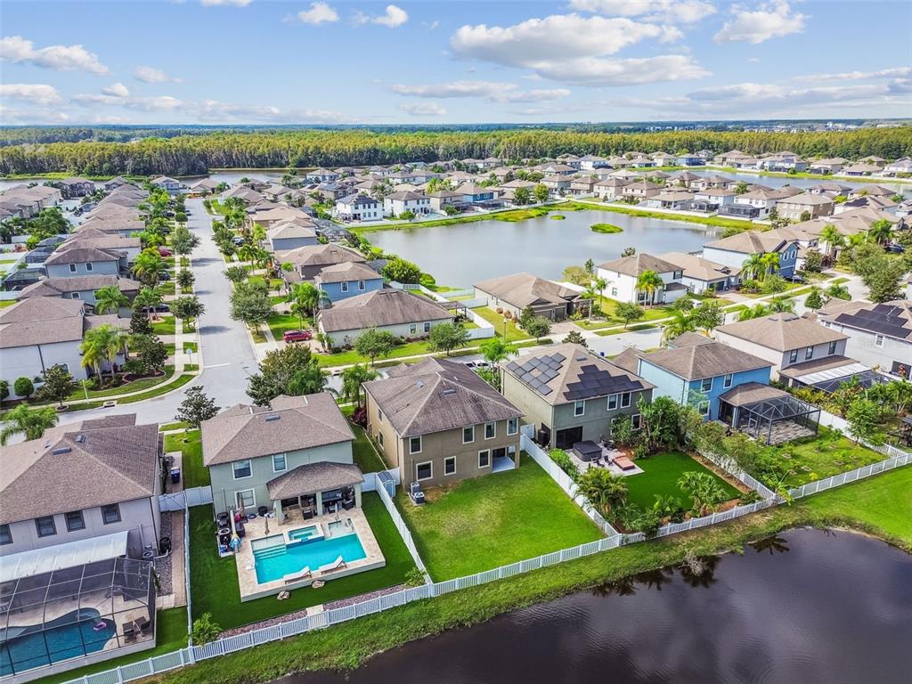11737 Crestridge Loop New Port Richey, FL 34655 - Photo 90 of 100 an aerial view of residential houses with outdoor space and river