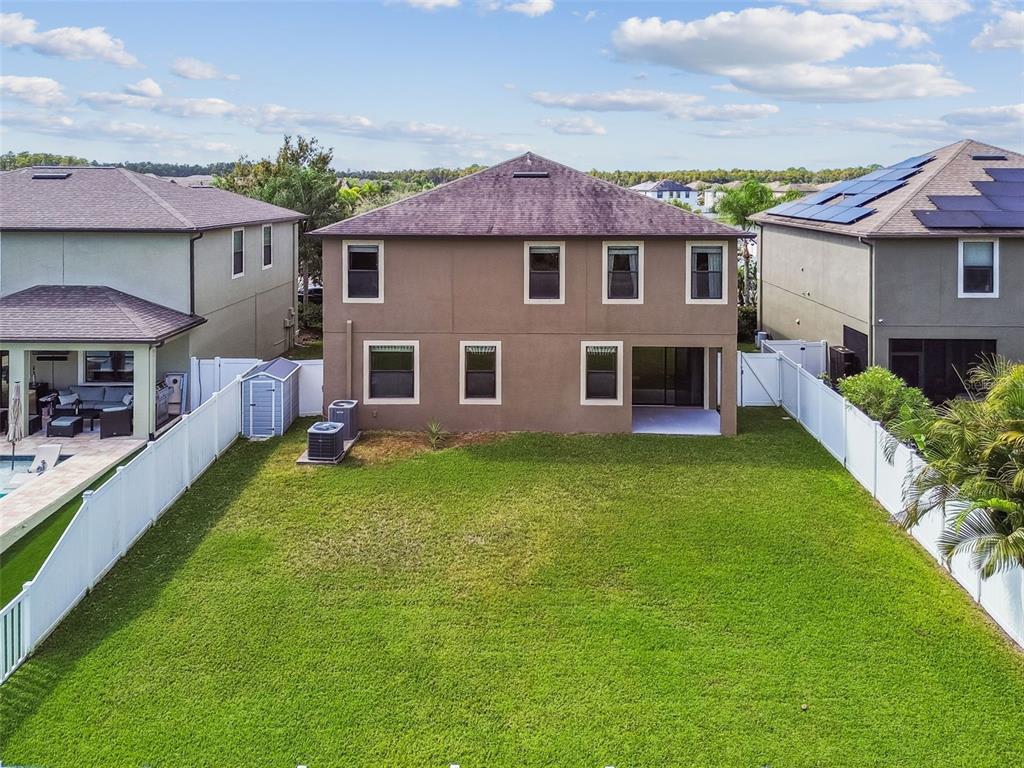 11737 Crestridge Loop New Port Richey, FL 34655 - Photo 99 of 100 front view of a house with a yard