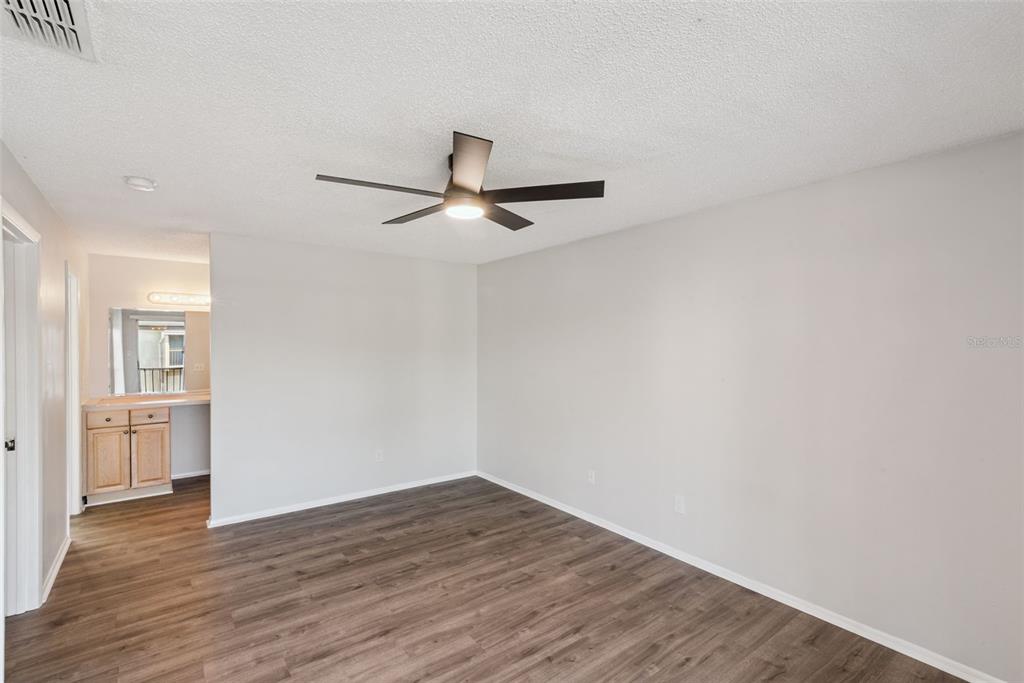 4449 Ring Neck Road, Unit C Orlando, FL 32808 - Photo 16 of 29 a view of empty room with wooden floor