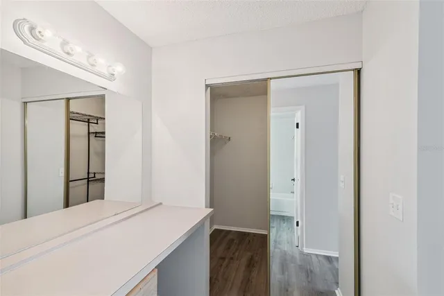 a room with a bed and a view of bathroom