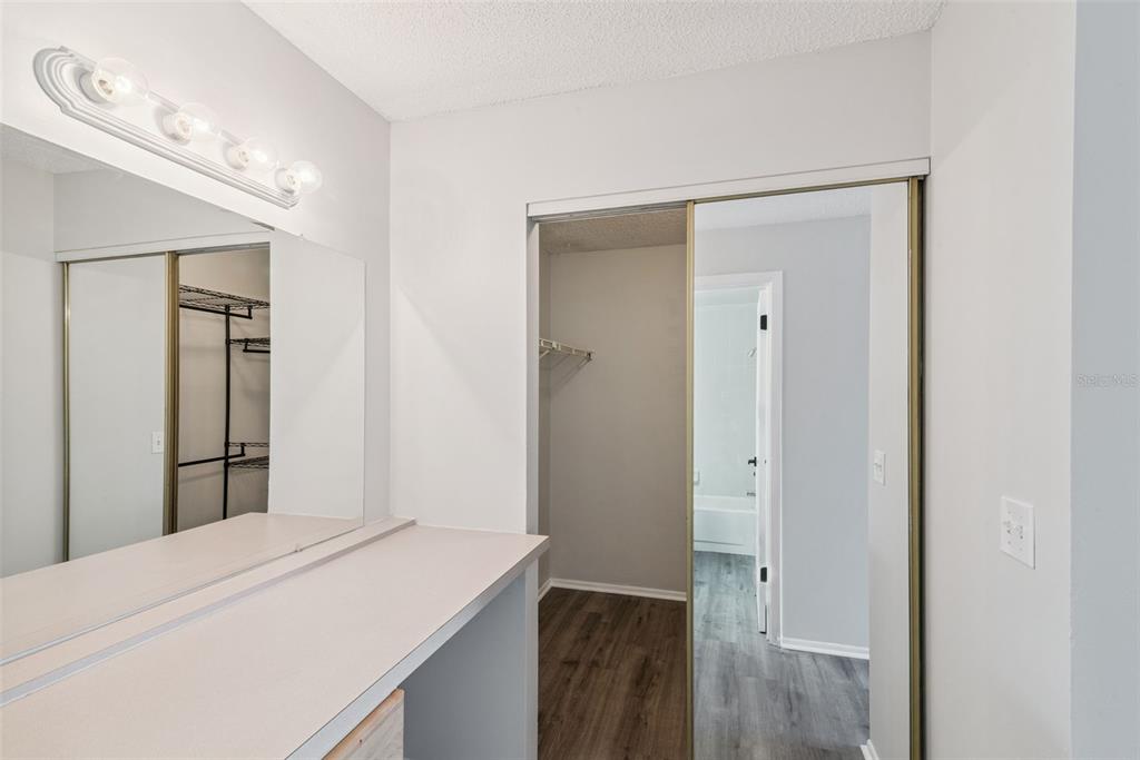 4449 Ring Neck Road, Unit C Orlando, FL 32808 - Photo 17 of 29 a room with a bed and a view of bathroom