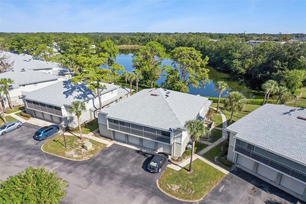 4449 Ring Neck Road, Unit C Orlando, FL 32808 - Photo 2 of 29 an aerial view of a house with garden space and street view