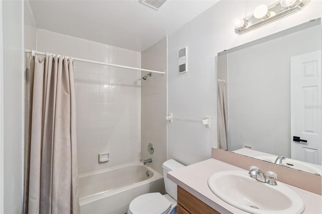 4449 Ring Neck Road, Unit C Orlando, FL 32808 - Photo 21 of 29 a bathroom with a sink toilet and shower