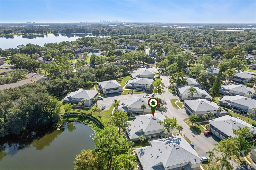 4449 Ring Neck Road, Unit C Orlando, FL 32808 - Photo 29 of 29 an aerial view of a city with lots of residential buildings lake and ocean view