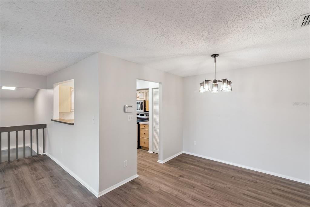 4449 Ring Neck Road, Unit C Orlando, FL 32808 - Photo 8 of 29 a view of empty room with wooden floor