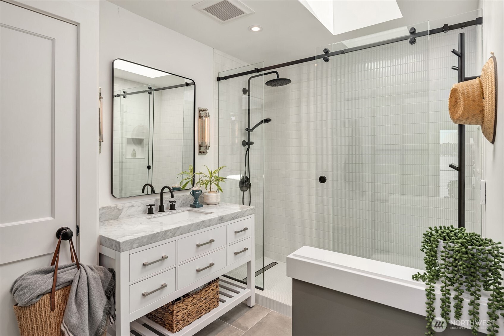 8097 West Mercer Way Mercer Island, WA 98040 - Photo 24 of 40 a bathroom with a sink a toilet and shower