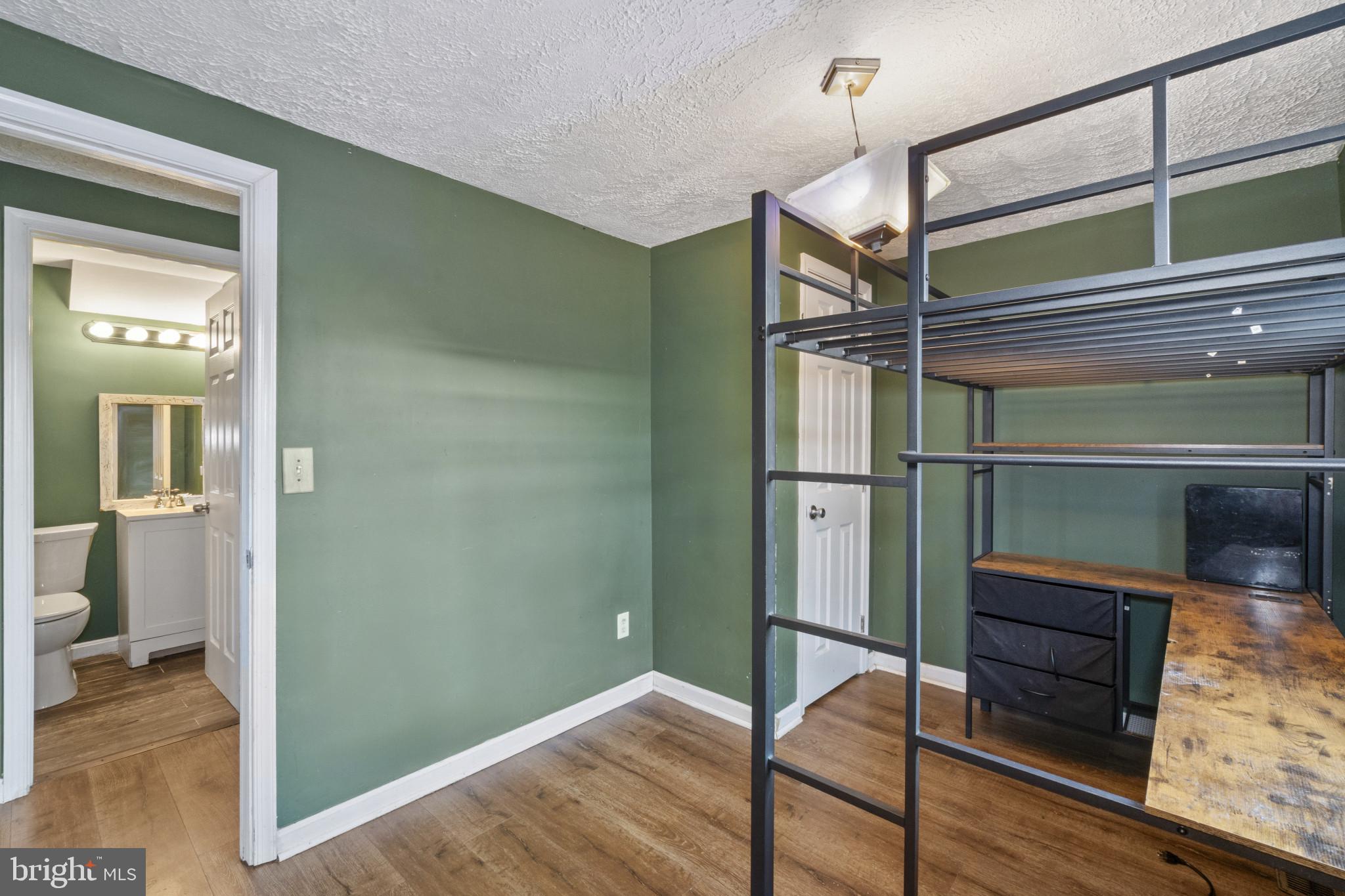 5904 Belle Grove Road Baltimore, MD 21225 - Photo 21 of 32 a view of hallway with wooden floor